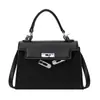 Bolsa cuadrada pequeña portátil de textura de moda para mujer, todo partido, bolsos 2024 primavera popular, nuevo bolso bandolera