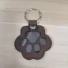 Armazenamento de Pelos de Pet Transfronteiriço Chaveiro de Couro a Laser Ornamento de Patinha de Cachorro Ornamento Lembrança de Pelos de Pet de Gato e Cachorro