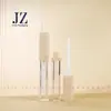 Tubo de brillo de labios biselado cuadrado hecho a medida Jinze con anillo central, 6 ml/7 ml, empaque de tubo vacío de plástico