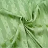 2110# jacquard rayado satinado florecido tela de primavera y verano imitación seda de hielo tela jacquard vestido ropa para el hogar