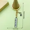 Venta Caliente Transfronteriza Cinta de Música Antigua Saxofón Órgano Llavero Diseño Creativo Sentido Colgante de Bolsa Pequeños Accesorios