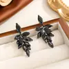 Brincos de Cobre Populares Transfronteiriços em Forma de Folha com Zircônia Olho de Cavalo e Inlays de Zircônia, Brincos Elegantes Banhados a Ouro com Acabamento de Luxo, Atacado