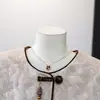 Nueva chaqueta corta de mujer estilo chino, elegante y versátil, con un toque de diseño inspirado en Chanel, adecuada para mujeres de mediana edad y mayores, chaqueta de cuello redondo