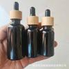 Fabricante en stock botella de aceite esencial de 5 ml a 100 ml negro negro brillante gotero de bambú subbotella de vidrio productos para el cuidado de la piel