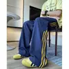 Pantalones deportivos de retazos a rayas estilo retro americano de seda helada de secado rápido, pantalones rectos holgados de moda de alta costura, pantalones casuales para adolescentes
