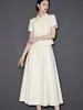 Conjunto de Saia com Manga Curta Laranja Damasco Estilo Pequeno Chanel Versátil Emagrecedor Temperamento Moda Verão 2026 Feminino