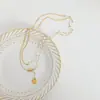 Collar de perlas de diseño de nicho de personalidad simple de alto grado de nuevo estilo francés, colgante de acero de titanio, cadena para la clavícula, joyería versátil