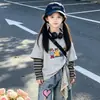 Conjunto de Primavera para Niñas 2026 Nuevo Estilo Coreano Moda Infantil Tendencia Top Falso de Dos Piezas Pantalones Vaqueros Conjunto de Dos Piezas