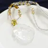 Collar colgante de zorro de nueve colas natural tridimensional de alta calidad para mujer flor de durazno cristal individual de nicho cadena para suéter de novias venta al por mayor