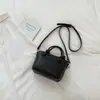 Bolso cuadrado pequeño de alta calidad con patrón tejido de color sólido de moda, nuevo estilo principios de otoño 2026, bolso de hombro o axila elegante y simple para el trabajo