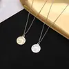 Colar Pequeno Príncipe feminino pingente de moeda inglesa luz luxo nicho senso de design retrô redondo marca corrente de suéter vendas diretas da fábrica