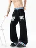 Jeans patchwork de doble cintura estilo americano para mujer y hombre, diseño apilado de alta costura para verano, pantalones de dobladillo curvo con estampado de letras, pantalones de pierna recta