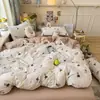 Set súper suave de cuatro piezas de algodón gofrado con estampado floral fresco, adecuado para dormitorio y uso doméstico, incluye sábana bajera y funda de edredón, set floral de tres piezas para exportación
