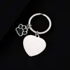 Llavero de metal con huella de perro brillante de acero inoxidable europeo y americano grabado a láser con impresión de color UV en blanco sin palabras para uso transfronterizo