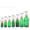 Botellas dispensadoras de aceites esenciales 10ml 30ml con tapa de madera, botellas verdes para aceites esenciales con gotero, botellas de vidrio para aceites esenciales, botellas vacías, gama alta