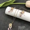 Conjunto de pendientes y collar Xuping estilo vintage de nicho europeo y americano transfronterizo, conjunto de joyería elegante de aleación de cobre, venta al por mayor y hecho a medida