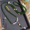 Estilo Chino Nuevo estilo chino retro borla Pieza curva de jade Hebilla de seguridad Ágata Yanyuan Cadena cruzada Collar superpuesto para mujer