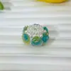 Nova camélia luminosa borda de pérola flor de argila macia bola de flor furo reto contas DIY corrente de celular acessórios de caneta com contas