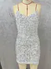 Ropa de mujer transfronteriza europea y americana lista para enviar: minivestido de tiras con lentejuelas plateadas, escote en V, corte ajustado, vestido bodycon para fiesta de noche