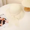 Sombrero de sol transfronterizo para mujer con lazo sombrero tipo cubeta protector solar sombrero de paja sombrero de papel ala ancha sombrero de playa sombrero casual venta al por mayor