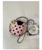 Moda de verano transfronteriza para mujer, bolso pequeño 2026, nuevo bolso tipo cubo de lunares, bolso sencillo para hombro cruzado, bolso para teléfono