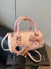 Bolsa de Mão de Moda Transfronteiriça com Laço Design Cilíndrico para Mulheres, Novo Estilo Verão 2026, Pingente de Espelho Personalizado, Bolsa de Ombro Único Transversal