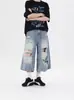Jeans de Sete Pontos com Design Rasgado Retrô para Homens e Mulheres Lavagem Americana Desgastado Solto Reto Shorts Tendência Atacado