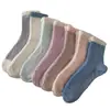 Calcetines de Piso de Invierno de Coral Fleece Retorcido de 7 Colores para Mujer de Amazon Transfronterizo al por Mayor
