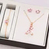 Conjunto de collar, aretes, pulsera y anillo con huella de pata de gato y corazón, estilo minimalista, transfronterizo - un regalo de joyería para mujer