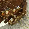 Collar de cadena para clavícula con colgante de cristal de vidrio estilo ins frío niche pequeño japonés y coreano para el trabajo cadena de titanio venta al por mayor