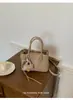 Bolsa Balde Portátil Super Popular Transfronteiriça para Mulheres 2026 Nova Moda Versátil Bolsa Transversal Estilo Coreano Nicho Bolsa de Ombro para o Dia a Dia