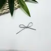 Material de cordón de mariposa de concha de ola sin cordón, cadena con etiqueta, base de bolsa con gancho plateado y cierre de resorte