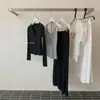 Conjunto de T-shirt de manga larga con cremallera estilo coreano + top halter con cuello de corbata + pantalones casuales holgados Y.JIA Otoño 1377
