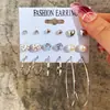 Set de pendientes de perla retorcida dorada estilo europeo y americano, pendientes metálicos geométricos en forma de C, pendientes para mujer de alta gama y únicos