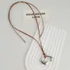 Moda Nuevo Cordón de Cuero Colgante Abstracto Irregular Collar Diseño de Nicho Versátil Cadena Larga de Lana para Mujer