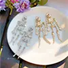 Pendientes de borlas con incrustaciones de diamantes transfronterizos europeos y americanos, pendientes exagerados de moda de nicho de alta gama, lujo ligero, pendientes únicos y elegantes para mujer