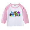 Camiseta infantil de primavera y otoño 2023, nueva camiseta de manga larga con cuello redondo y dibujos animados, camiseta de algodón para bebés y niños.