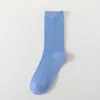 Meias de cor pura femininas de algodão meia-panturrilha felpudas para primavera, verão, outono e inverno meias femininas listradas Zhuji doces ins meias de algodão atacado