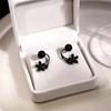 Pendientes de flores negras de nuevo estilo para primavera y verano para mujer, diseño de lujo ligero japonés y coreano, pendientes de circonita de dos piezas.