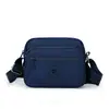 2026 Nova Bolsa Feminina de Cor Sólida Tendência Moda Cor Sólida Ombro Único Transversal Simples Bolsa Feminina de Nylon Casual Pequena Quadrada