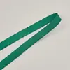 Correa plana de cuadrícula cuadrada de 1 cm de colores en stock, correa de hombro de felpa antideslizante de un solo lado, banda elástica de poliéster cepillado para ropa interior