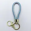Venta al por mayor del fabricante Llavero de Cuerda de Aleación Tejida y Cuero Accesorios Colgantes Material PU Bolsas Pequeñas de Regalo Accesorios para Llaveros