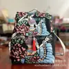 Mochila de estilo étnico de Yunnan color arena, bolsa de viaje y ocio para mujer, nuevo diseño con bordado de hilo dorado, un imprescindible para vendedores ambulantes