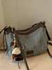 Bolsa tejida casual para mujer Shuai Mi Jia, nuevo estilo de otoño 2026, bolsa de paja, bolso de hombro y cruzado de moda nicho