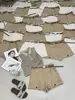Top de Tela Delgada de Verano Estilo Europeo Líneas Trece de Guangzhou Versión Coreana Pantalones Cortos Casuales de Corte A con Cinturón 20225