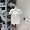 Top lavado retro juguetón de capas plisadas con cuello de muñeca y dobladillo deshilachado holgado