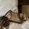 2026 Nueva Bolsa de Hombro con Estampado de Leopardo para Mujer, Versátil, de un Solo Hombro, Cruzada, Bolsa tipo Dumpling, Gamuza, para Viajes, Moda de Nicho, Sensación de Alta Gama