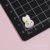 Mini trébol de cuatro hojas brillante de dibujos animados conejo Miffy accesorios de resina para manualidades pegamento de crema pinzas para el pelo gomas para el pelo fundas de teléfono pegatinas