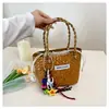 Bolsa de Praia Transfronteiriça Feminina 2025 Primavera Nova Bolsa Cesto de Legumes Moda Bolsa de Palha Tecida à Mão