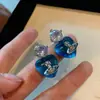 Brincos Saturno Coração Azul Zircônia para Mulheres Design de Nicho Sexy de Alta Qualidade Brincos de Clipe para Cartilagem Auricular Planeta Elegante para Mulheres